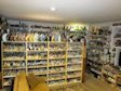 Front view of the main bottle room 
on the first floor. Displays are double sided. Rear shelves and walls are full of minibottles.