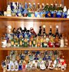Rear shelves. Cazanove and Cointreau, French miniature liqueur bottles.